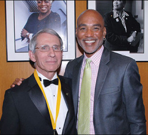 Anthony Fauci, M.D., director, National Institute of Al-lergy and Infectious Diseases, is congratulated by Phill Wilson, President and CEO, Black AIDS Institute at the organization’s Heroes in the Struggle Gala Reception and Awards Presentation. 