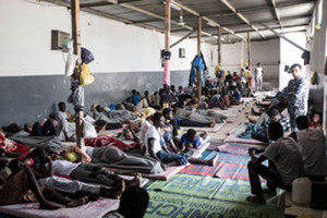 West African migrants rest in the Abu Salim detention center. 