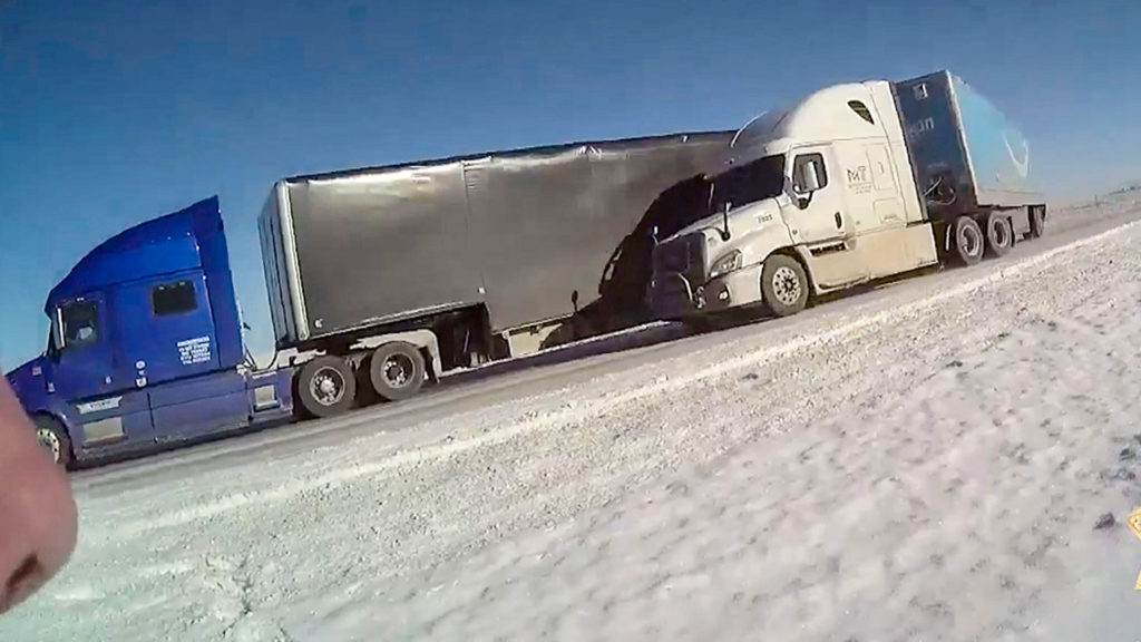 US Cop Leaps Clear As Truck Crashes Into Multi-Utility Truck