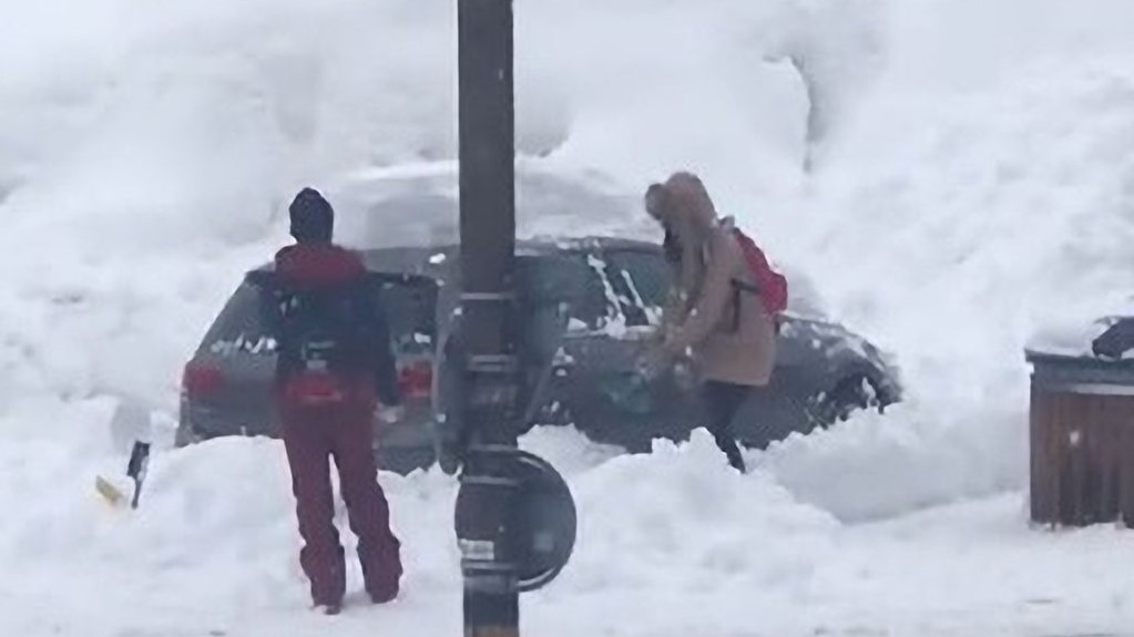 Man Ridiculed For Watching Woman Dig Her Car Out of Snowdrift