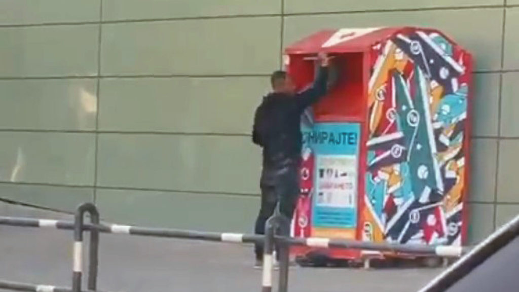 VIDEO: Self Service: Man Filmed Pushing Boy Into Charity Box For Needed Clothing