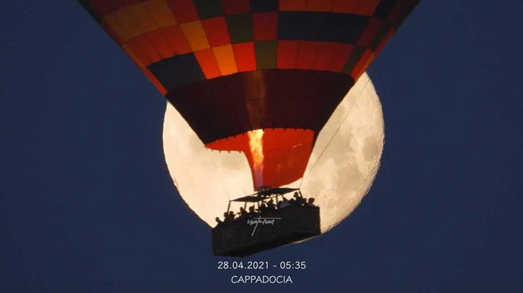VIDEO: Picture Perfect: Photographer Captures Balloon In Front Of Rare Pink Moon