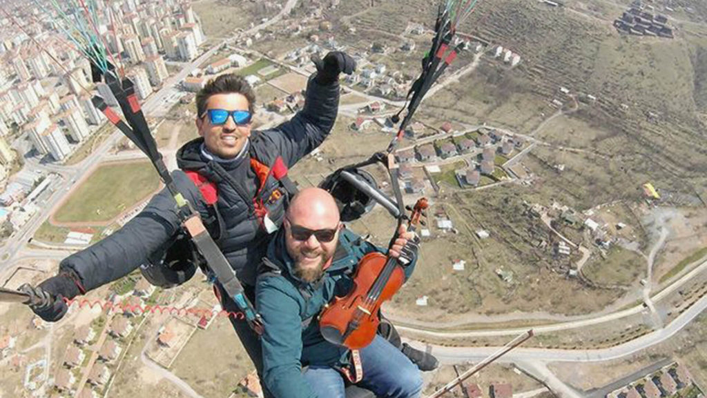 VIDEO: String And A Prayer: Nervous Paraglider Plays Violin To Soothe First Flight Nerves