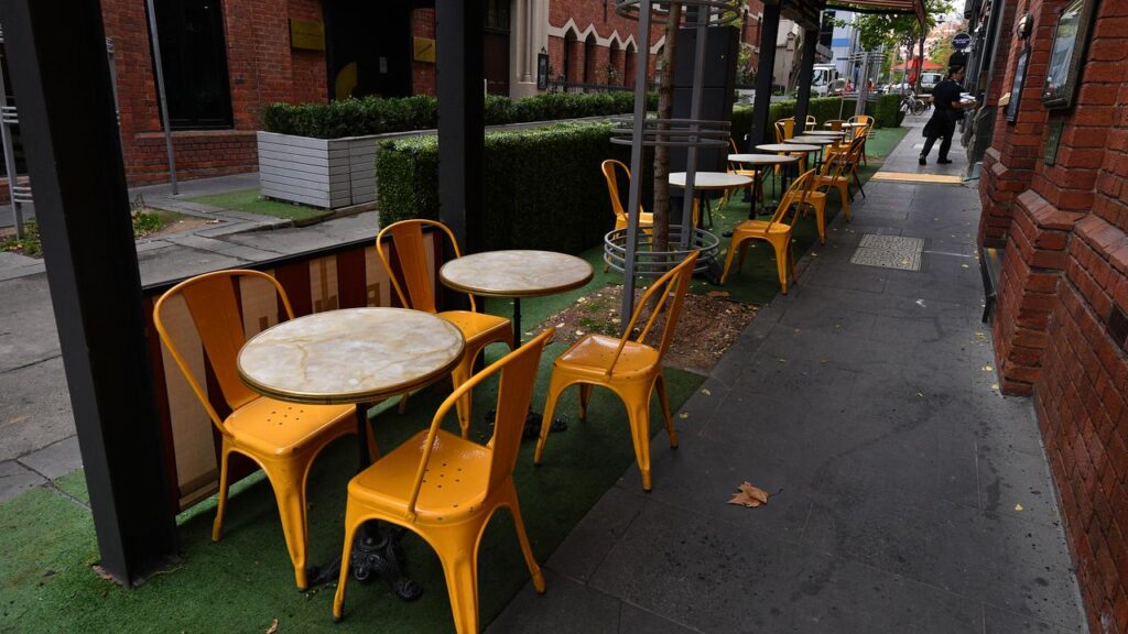 Empty seats at a cafe in Melbourne as the city's lockdown continues.