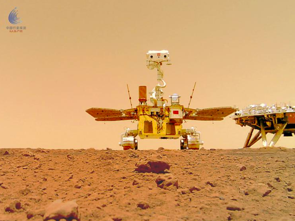 The China National Space Administration (CNSA) released a series of photos from the surface of Mars, June 11, 2021 taken by Mars rover Zhurong. This photo of the Zhurong rover itself, also known as a “selfie,” was taken from a wireless remote camera that was dropped into position by the rover. (China National Space Administration)