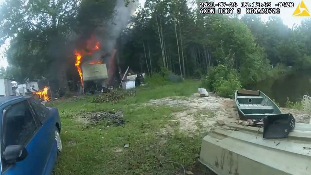 VIDEO: Cops Risk Lives To Save 2 Trapped Dogs Near Burning Trailer