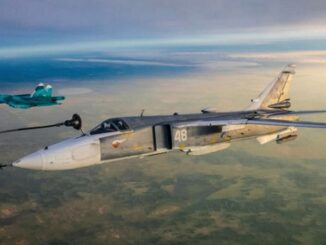 The Russian jet in the foreground has a fuel line attached for a midair refill over the country's the South Urals. (Ministry of Defense of the Russian Federation/Zenger)